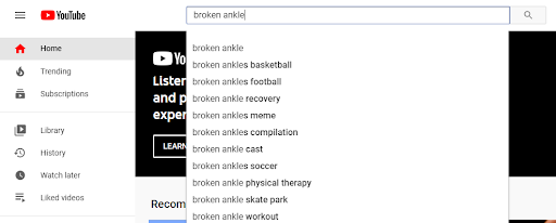 Image showing somebody typing in “broken ankle” into the YouTube search box. 